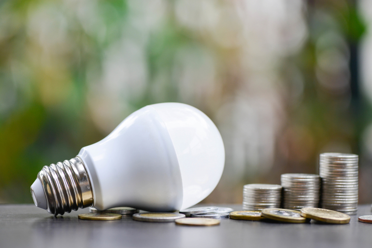 LED Bulb and Coin stack - Saving concept